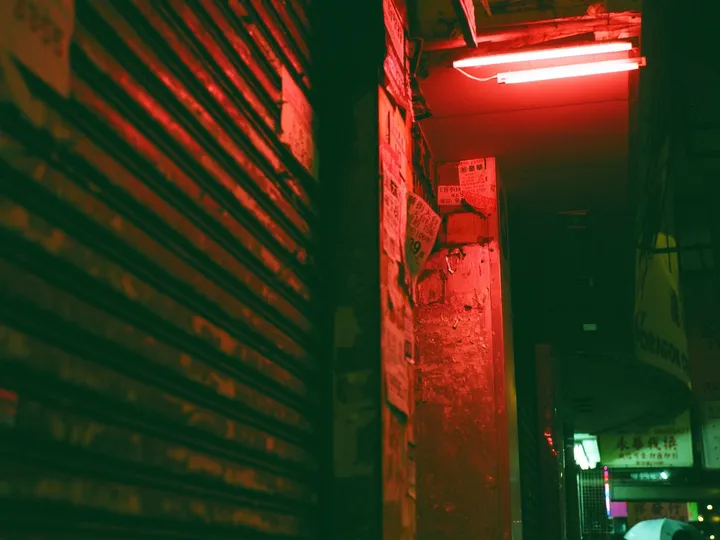 A neon-lit cyberpunk street at night
